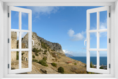 Fototapeta Naklejka Na Ścianę Okno 3D - Ancient tower and church near fortress in Sudak, Crimea, Russia.