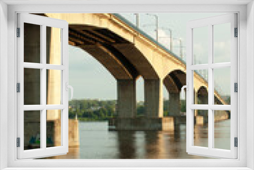 Fototapeta Naklejka Na Ścianę Okno 3D - Bridge over the river with display in the water.