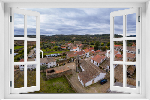Drone aerial view of Idanha a velha historic village and landscape with Monsanto on the background, in Portugal