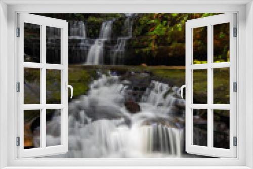 Fototapeta Naklejka Na Ścianę Okno 3D - Water flowing through multi-level waterfalls.