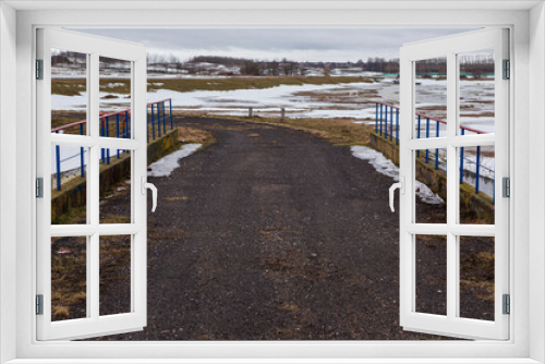Fototapeta Naklejka Na Ścianę Okno 3D - winter sandy road on a vacant lot