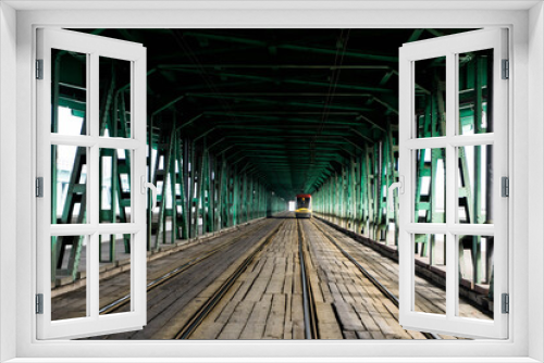 Fototapeta Naklejka Na Ścianę Okno 3D - tunnel of the old green bridge on which the tram travels