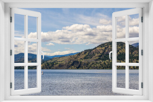 Fototapeta Naklejka Na Ścianę Okno 3D - calm morning lake in British Columbia Canada blue sky with white clouds.