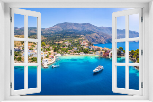 Fototapeta Naklejka Na Ścianę Okno 3D - Aerial view to the beautiful fishing village of Assos on the island of Kefalonia, Greece, surrounded by turquoise sea and green hills with Pine Trees