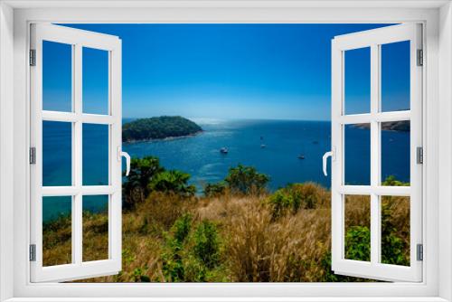 Fototapeta Naklejka Na Ścianę Okno 3D - The natural background of the morning light rising in the middle of the sea and surrounded by mountains, cool breezes, the beauty of the ecology of the tourist attractions.