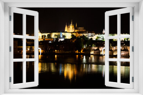 Prague cityscape at night with Vltava River, Czech Republic