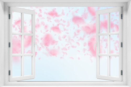 Fototapeta Naklejka Na Ścianę Okno 3D - Sakura petals falling down. Romantic pink flowers gradient. Flying petals on blue sky wide backgroun