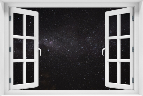 Fototapeta Naklejka Na Ścianę Okno 3D - a long exposure of the dark sky with the stars