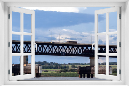 Fototapeta Naklejka Na Ścianę Okno 3D - View of the Rollemberg-Vuolo railroad Bridge, is a mixed bridge that serves to cross Parana River	
