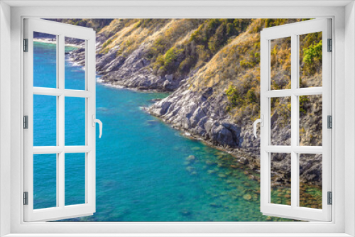 Fototapeta Naklejka Na Ścianę Okno 3D - The natural background of the morning light rising in the middle of the sea and surrounded by mountains, cool breezes, the beauty of the ecology of the tourist attractions.