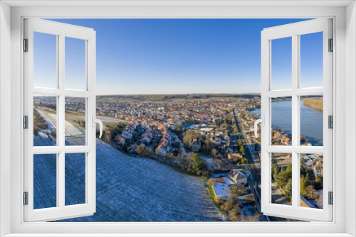 Fototapeta Naklejka Na Ścianę Okno 3D - Drone image of wine village Nierstein on the Rhine in blue sky and sunshine with snow covered slopes