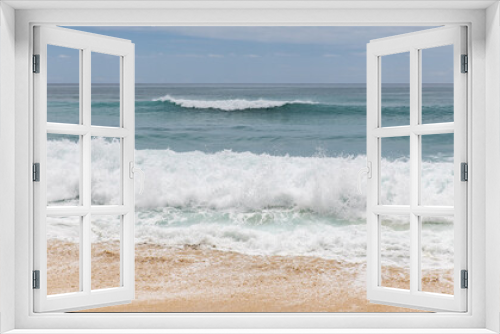 Fototapeta Naklejka Na Ścianę Okno 3D - Seascape background. Sandy beach, milky foam waves, blue ocean. Scenic waterscape. Horizon line. Nature and environment concept. Daylight. Copy space. Dreamland beach, Bali