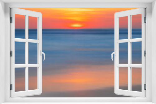 Fototapeta Naklejka Na Ścianę Okno 3D - Sunset and beach. Seascape background. Bright sunlight. Sun at horizon line. Scenic view. Colorful sky. Sunlight reflection in water. Magnificent scenery. Copy space. Bali