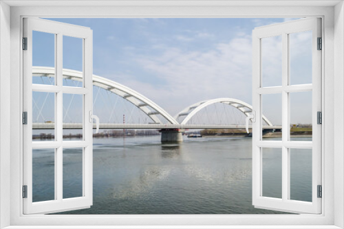 Fototapeta Naklejka Na Ścianę Okno 3D - Novi Sad, Serbia - March 08. 2021: Zezelj bridge on river Danube in Novi Sad Serbia. The prospect of built New Zezelj Bridge viewed from the Petrovaradin side of the promenade.