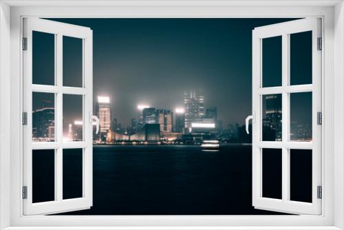 Fototapeta Naklejka Na Ścianę Okno 3D - Modern office buildings in Hong Kong at foggy night