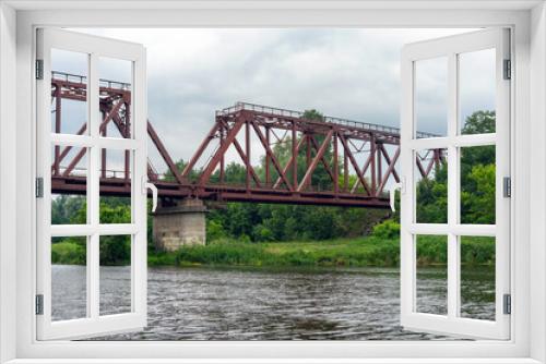 Fototapeta Naklejka Na Ścianę Okno 3D - Old rusty railway bridge over the river