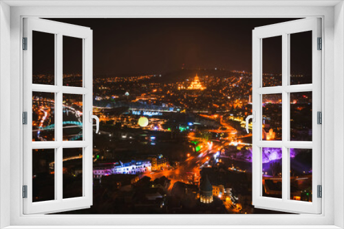 Fototapeta Naklejka Na Ścianę Okno 3D - Tbilisi night city panorama with passing cars sightseeing attractions. Travel Georgia blank space background