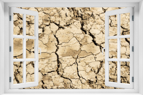 Fototapeta Naklejka Na Ścianę Okno 3D - Background suitable for drought images of clods of earth and dry earth with cracks, macro photography of detail of cracks on the earth formed by the sun drying the earth, no water.