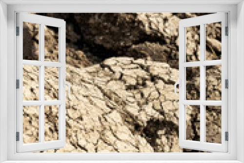 Fototapeta Naklejka Na Ścianę Okno 3D - Background suitable for drought images of clods of earth and dry earth with cracks, macro photography of detail of cracks on the earth formed by the sun drying the earth, no water.