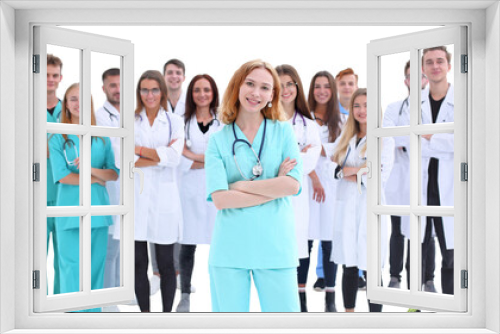 top view. a group of smiling doctors pointing at you.