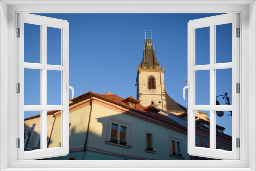 Fototapeta Naklejka Na Ścianę Okno 3D - Gothic Church of St Nicholas in Louny town, Czech Republic. Church from 16. century designed by royal architect Benedikt Rejt. Stone church tower. Tented roof in gothic architecture. 