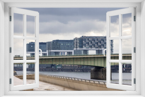 Fototapeta Naklejka Na Ścianę Okno 3D - Modern Cologne skyline near Rhine river in spring overcast weather