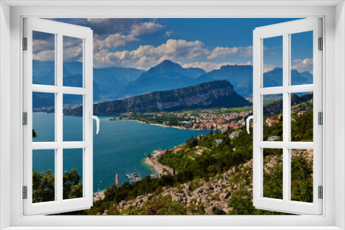 Fototapeta Naklejka Na Ścianę Okno 3D - Panoramic view on Lake Garda from the Busatte-Tempesta trail near Nago-Torbole with the iron staircase,  Torbole  town surrounded by mountains in the summer time,Italy