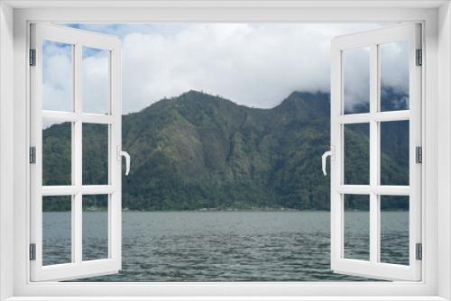 Fototapeta Naklejka Na Ścianę Okno 3D - View of Lake Batur which is surrounded by hills