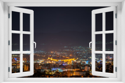 Fototapeta Naklejka Na Ścianę Okno 3D - Elevated view of Skopje cityscape at night