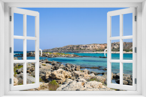 Fototapeta Naklejka Na Ścianę Okno 3D - The other side of Elafonisi beach, a stone beach overlooking the blue sea. Crete island, Greece