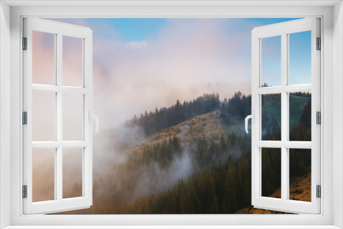 Fototapeta Naklejka Na Ścianę Okno 3D - Panoramic view of the misty mountains in the countryside.