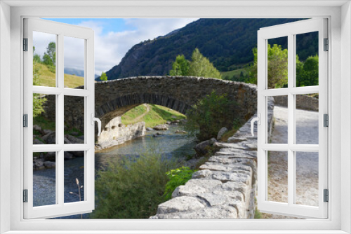 Fototapeta Naklejka Na Ścianę Okno 3D - small stone bridge over a stream in front of the Pyrenees mountains in Gavarnie