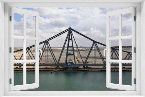 Fototapeta Naklejka Na Ścianę Okno 3D - Landscape of Suez Canal, view from transiting cargo ship. Bridge construction on the Canal bank. 