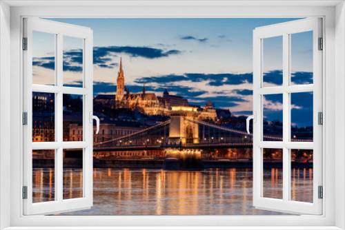 Twilight in Budapest, the Chain Bridge over the Danube, the reflection of night lights on the water