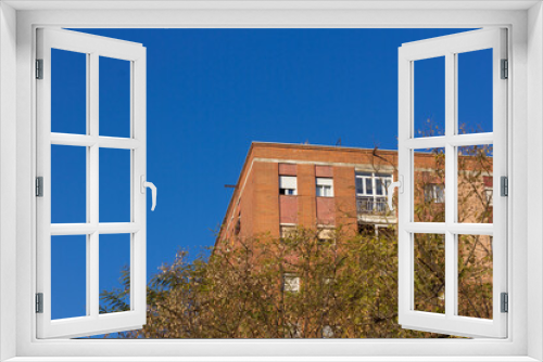 Fototapeta Naklejka Na Ścianę Okno 3D - Building corners, working class neighbourhood windows