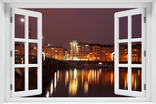 Fototapeta Naklejka Na Ścianę Okno 3D - Historic bridge in Prague city center in night, lights mirroring in river, dancing house and Manes landmarks, Prague, Czech Republic