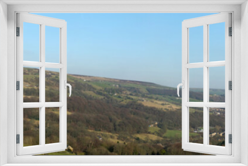 Fototapeta Naklejka Na Ścianę Okno 3D - panoramic view of the calder valley in west yorkshire with the town of mytholmroyd surrounded by fields, woods and moorland