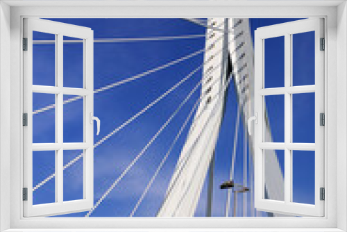 Fototapeta Naklejka Na Ścianę Okno 3D - Erasmus Bridge, Rotterdam, Netherlands.
Combined cable-stayed and bascule bridge. White lines and blue sky.