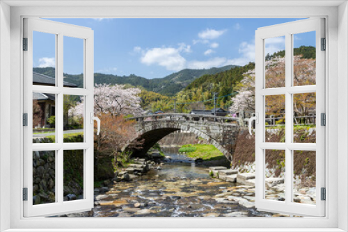 Fototapeta Naklejka Na Ścianę Okno 3D - 野鳥川に架かる石造秋月の目鏡橋と桜の風景