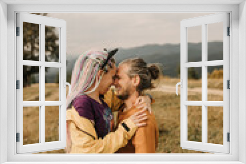 couple in love enjoying each other and walking in the mountains