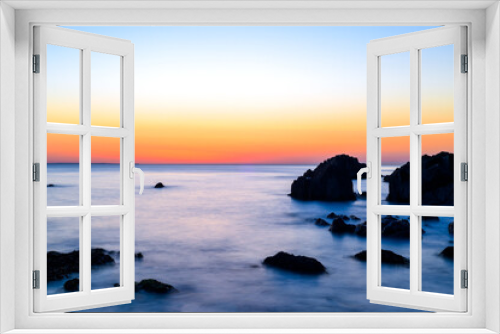Fototapeta Naklejka Na Ścianę Okno 3D - Beautiful calm sea and sunset scenery on the ocean as light reflects on the water