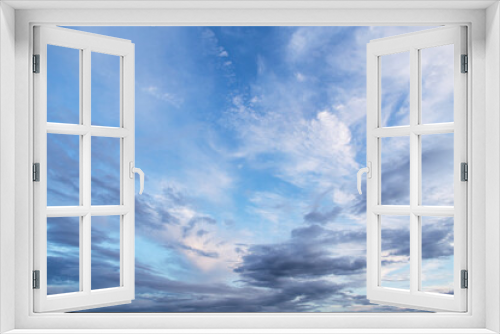 Beautiful epic blue sky with white and grey cirrus clouds background texture