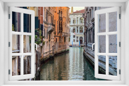 Fototapeta Naklejka Na Ścianę Okno 3D - Small canal in Venice, Italy, with balcony, and, blue sky reflexion on water, no boat, no people