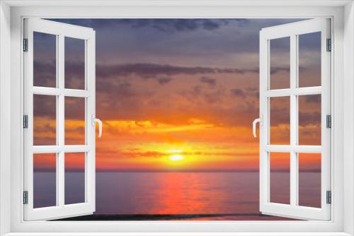 Fototapeta Naklejka Na Ścianę Okno 3D - dramatic sunset over the quiet sea bay