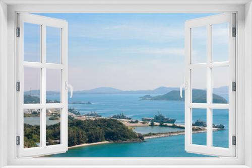 Fototapeta Naklejka Na Ścianę Okno 3D - High point view for looking at the location of Sattahip Naval Base with clear sky and blue sea. Sea view and the island close to Sattahip Naval Base, Thailand.