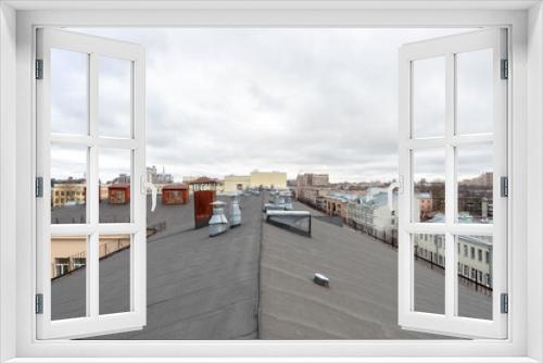 Fototapeta Naklejka Na Ścianę Okno 3D - View on the city from the roof of building