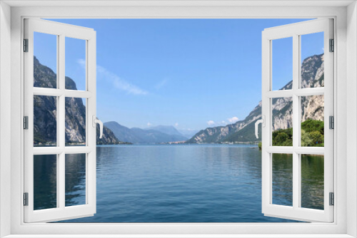 Fototapeta Naklejka Na Ścianę Okno 3D - Beautiful landscape, panoramic view of mountain and lake Como in Lecco city, Italy, blue water and clear sky background