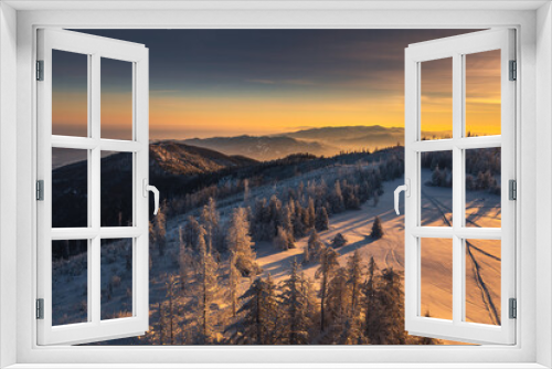Fototapeta Naklejka Na Ścianę Okno 3D - Winter morning in Gorce on the tower on the top of Lubań. A beautiful, romantic atmosphere with a view of the Pieniny Mountains, the Beskids and the Tatra Mountains.
