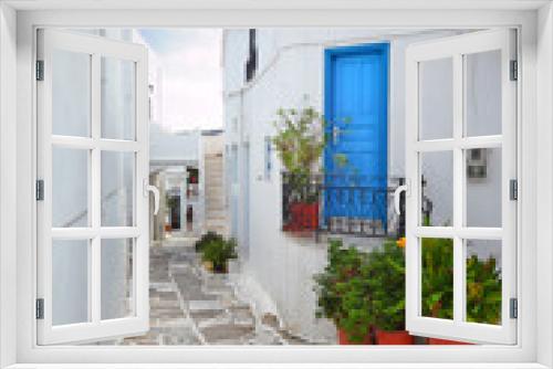 Fototapeta Naklejka Na Ścianę Okno 3D - Beautiful alley with whitewashed houses at the traditional village of Lefkes, in Paros island, Cyclades islands, Greece, Europe.