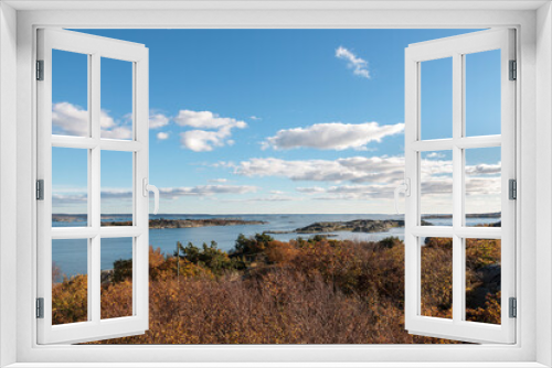 Fototapeta Naklejka Na Ścianę Okno 3D - High-level view of the sea around islands of the Southern Gothenburg Archipelago, in Sweden, during a sunny day with blue sky and clouds. Archipelago of Gothenburg 